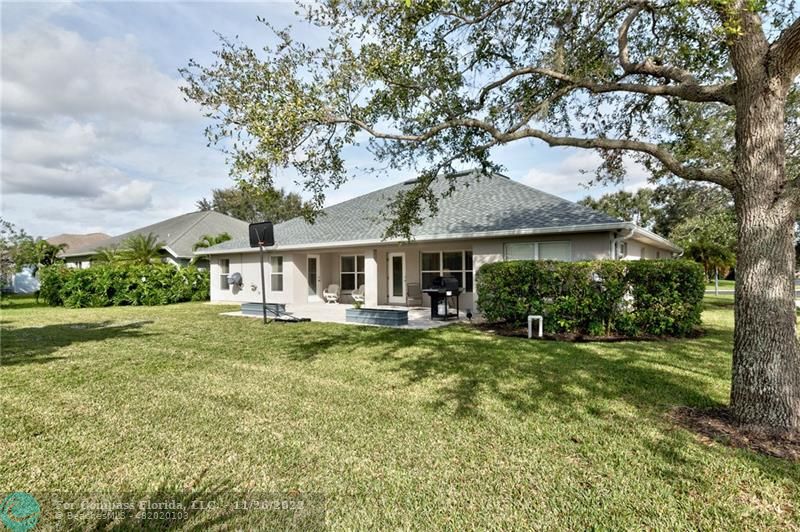 132 Drake Way Sebastian, FL 32958 - Photo 31 of 37 a front view of a house with a garden and porch