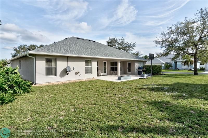 132 Drake Way Sebastian, FL 32958 - Photo 32 of 37 a front view of a house with garden