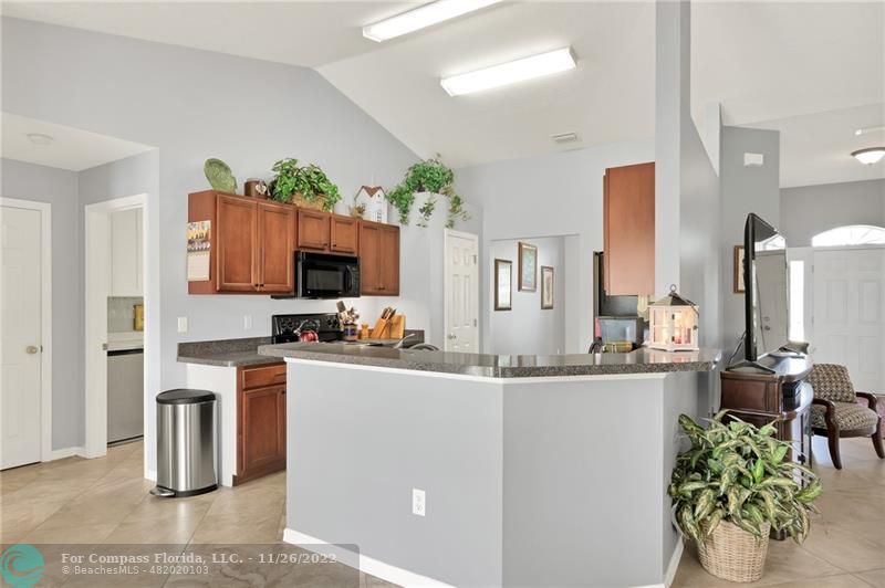 132 Drake Way Sebastian, FL 32958 - Photo 10 of 37 a kitchen with stainless steel appliances a stove refrigerator sink and cabinets