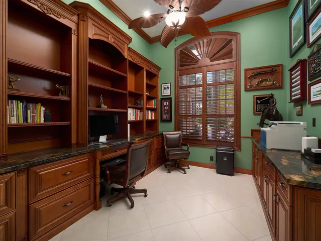 a living room with furniture a fireplace and a table