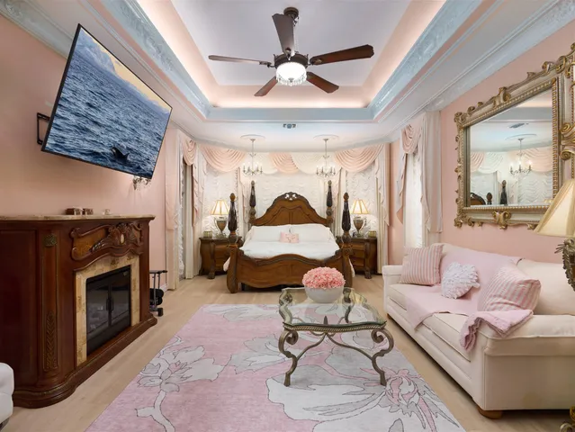 a living room with furniture and a fireplace