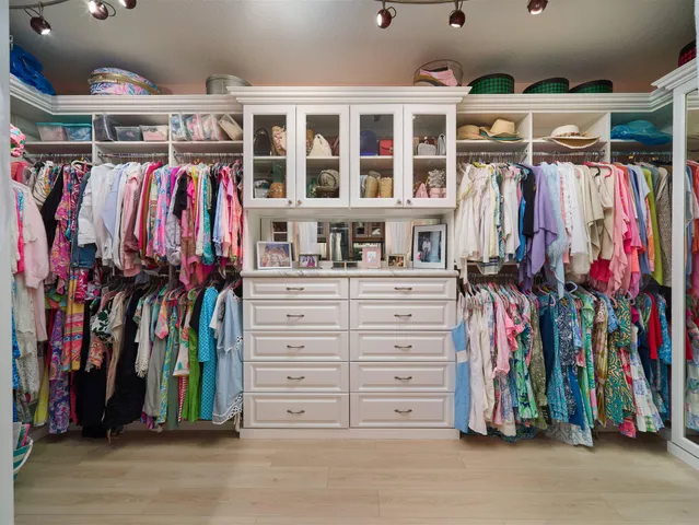 a view of a bathroom with a tub shower and mirror