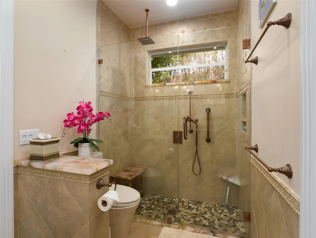 a bed room with a bed and a chandelier