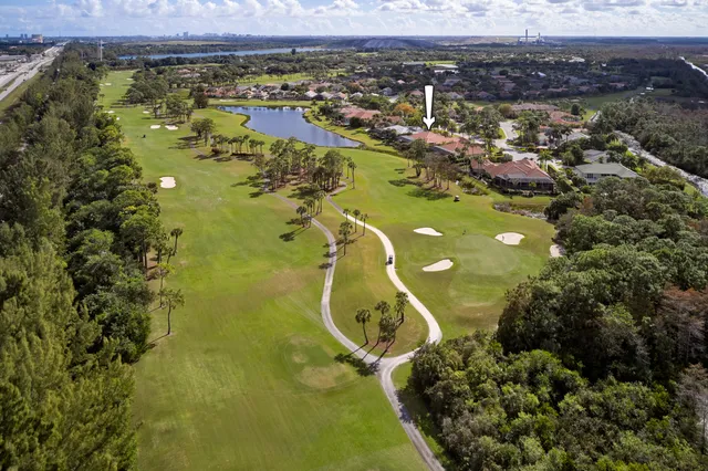 an aerial view of residential houses with outdoor space and river