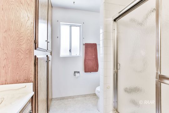 231 South Locust Street Ridgecrest, CA 93555 - Photo 15 of 35 a bathroom with a sink and a toilet