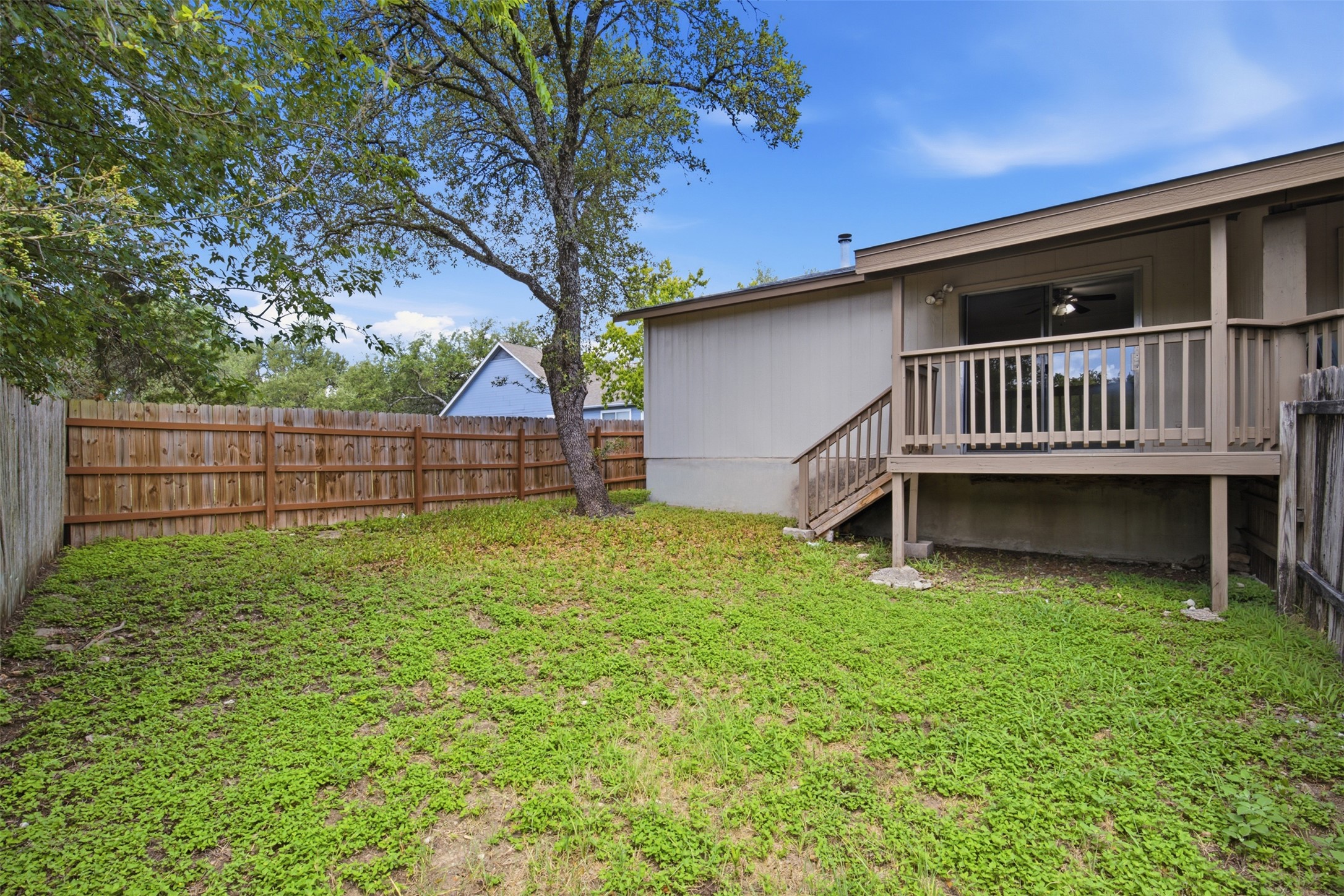 11611 Rustic Rock Drive, Unit B Austin, TX 78750 - Photo 22 of 30 A fenced backyard offers a private outdoor retreat