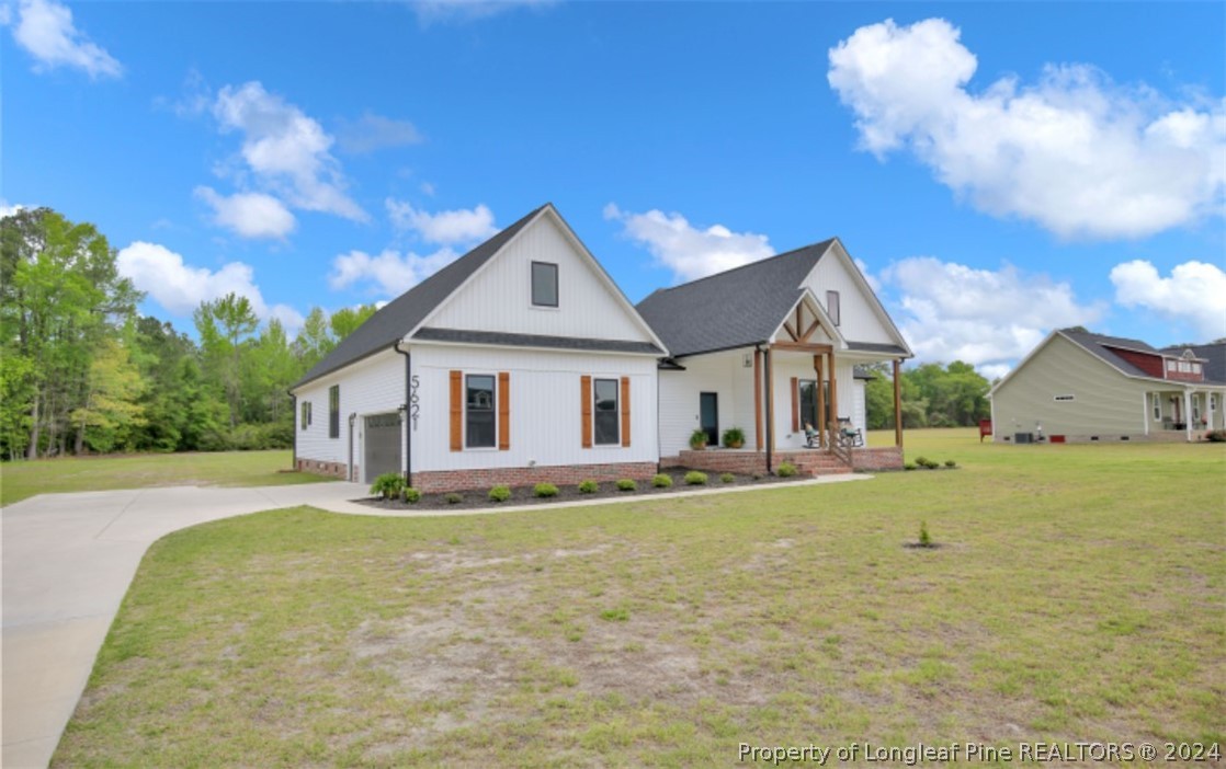 5621 Toby Pl Road Stedman, NC 28391 - Photo 2 of 38 a front view of a house with a yard