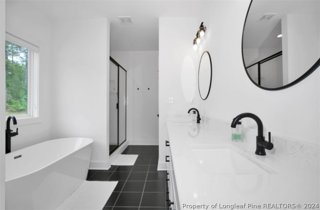5621 Toby Pl Road Stedman, NC 28391 - Photo 24 of 38 a bathroom with a sink a toilet and a mirror