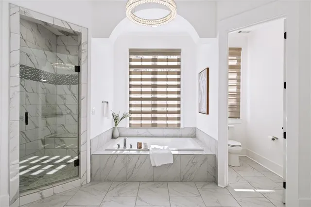 a bathroom with a bathtub and window