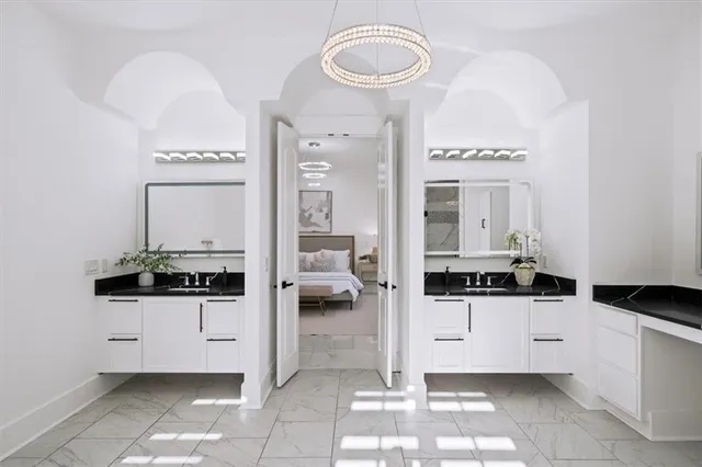 a bathroom with a sink a mirror and a toilet