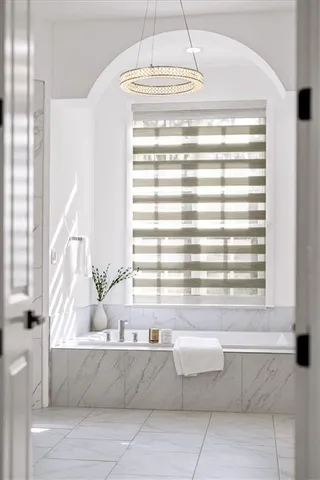 a view of empty room with wooden floor and floor to ceiling window