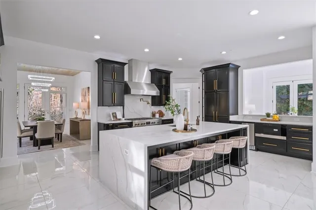 a large kitchen with a table and chairs