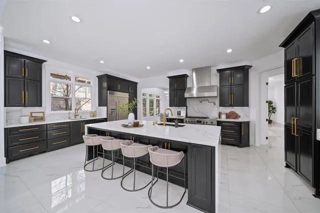 a large kitchen with a table and chairs
