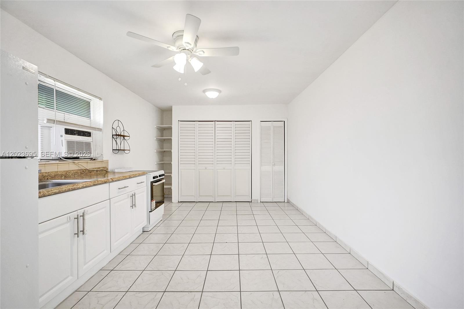 877 West 33rd Street, Unit A Hialeah, FL 33012 - Photo 14 of 36 Kitchen/Family/Dining Area