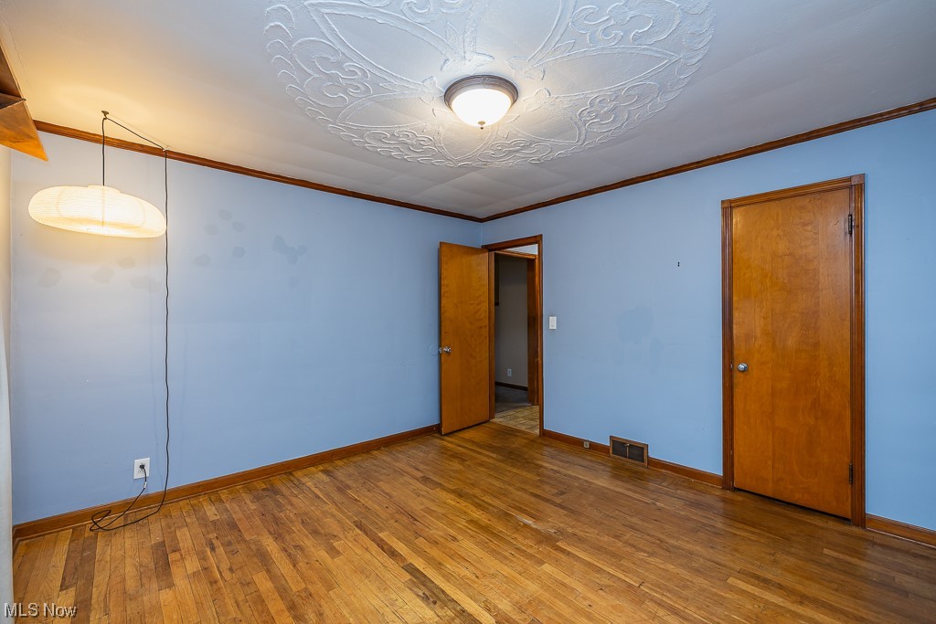 4651 East Pleasant Valley Road Independence, OH 44131 - Photo 13 of 28 Large closet and beautiful hardwood floors in first floor bedroom.
