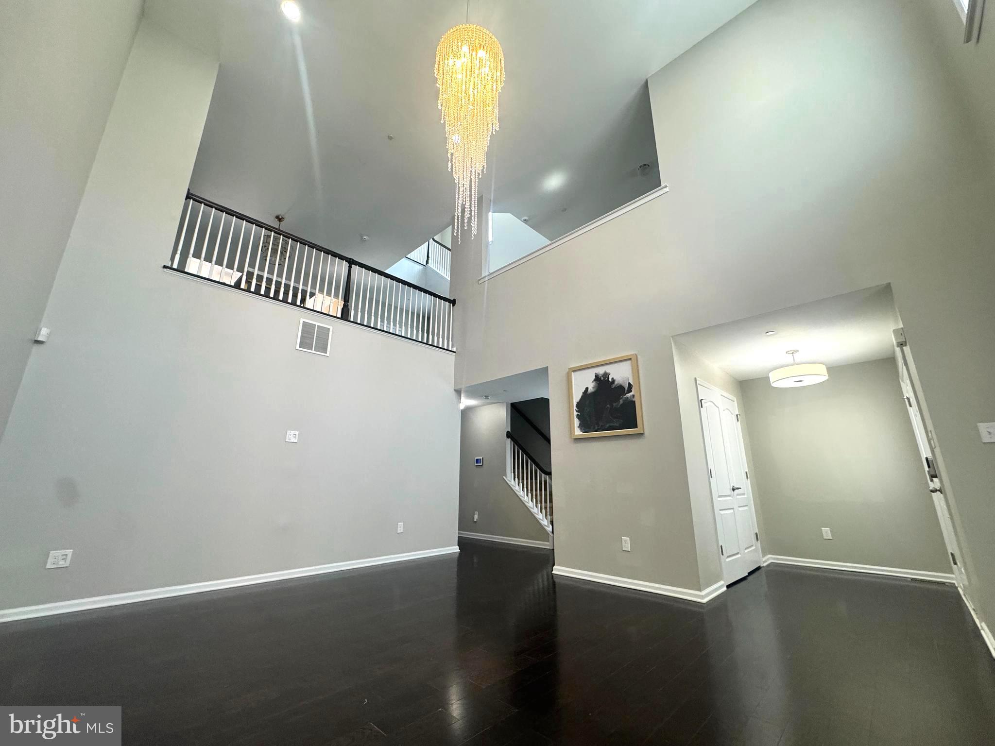 3313 Pietro Way Philadelphia, PA 19145 - Photo 15 of 16 an empty room with wooden floor and windows