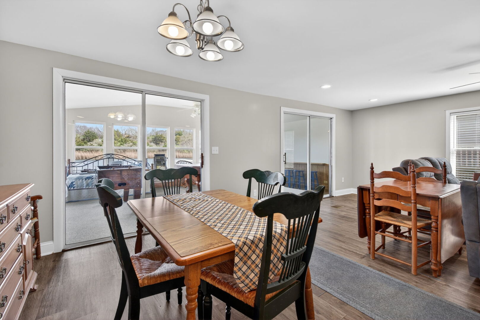 18530 West 3000 N Road, Unit 173 173 Reddick, IL 60961 - Photo 20 of 39 a view of a dining room with furniture a chandelier and wooden floor