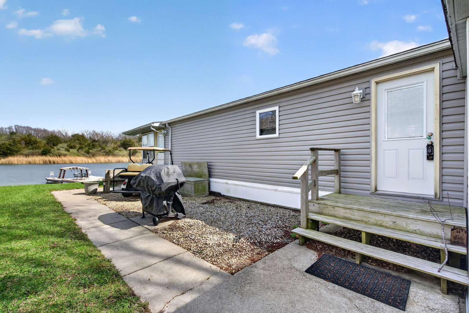 18530 West 3000 N Road, Unit 173 173 Reddick, IL 60961 - Photo 35 of 39 a view of a two chairs in the back yard of the house