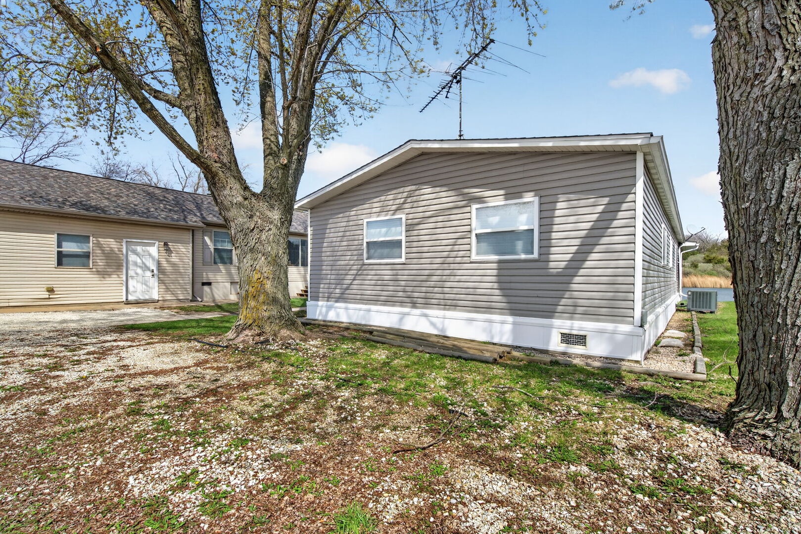 18530 West 3000 N Road, Unit 173 173 Reddick, IL 60961 - Photo 38 of 39 a view of a house with a yard