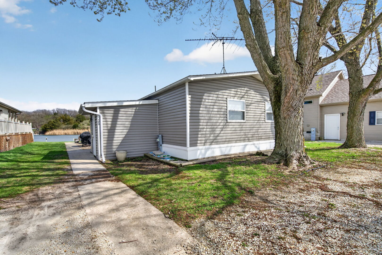 18530 West 3000 N Road, Unit 173 173 Reddick, IL 60961 - Photo 39 of 39 a front view of a house with a yard
