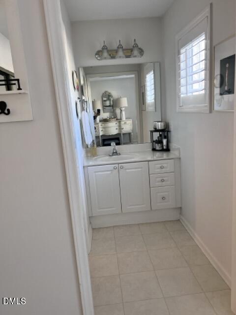 7601 Astoria Place Raleigh, NC 27612 - Photo 18 of 30 a bathroom with a sink a vanity and a mirror