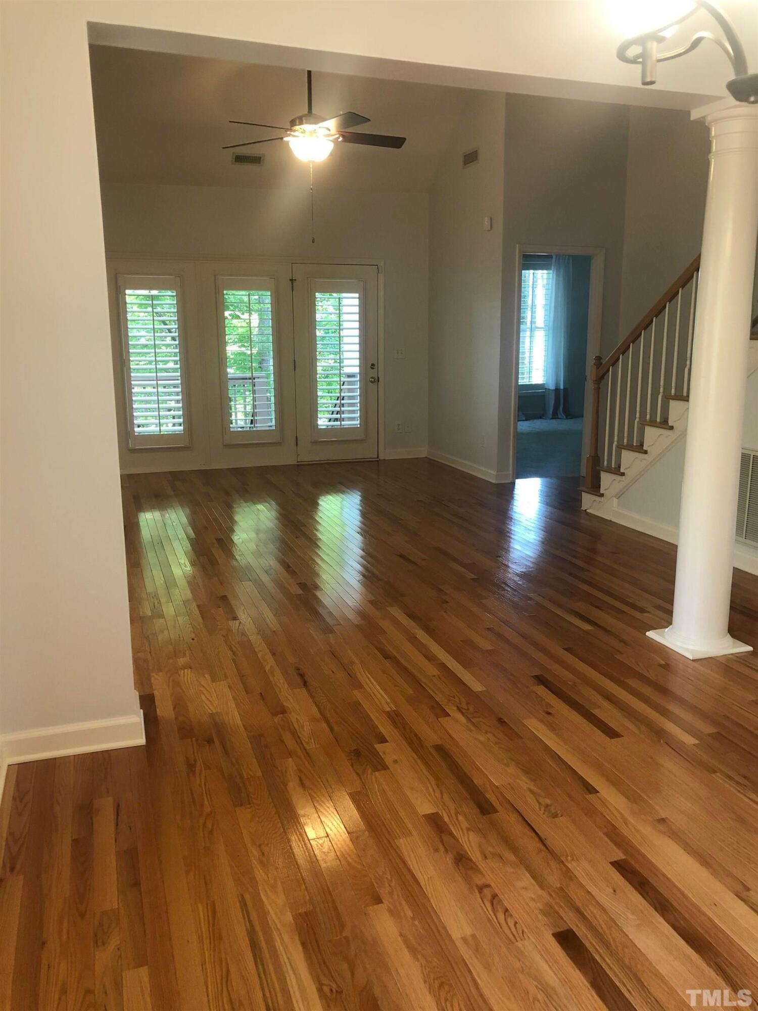 7601 Astoria Place Raleigh, NC 27612 - Photo 21 of 30 a view of livingroom with hardwood floor and hallway