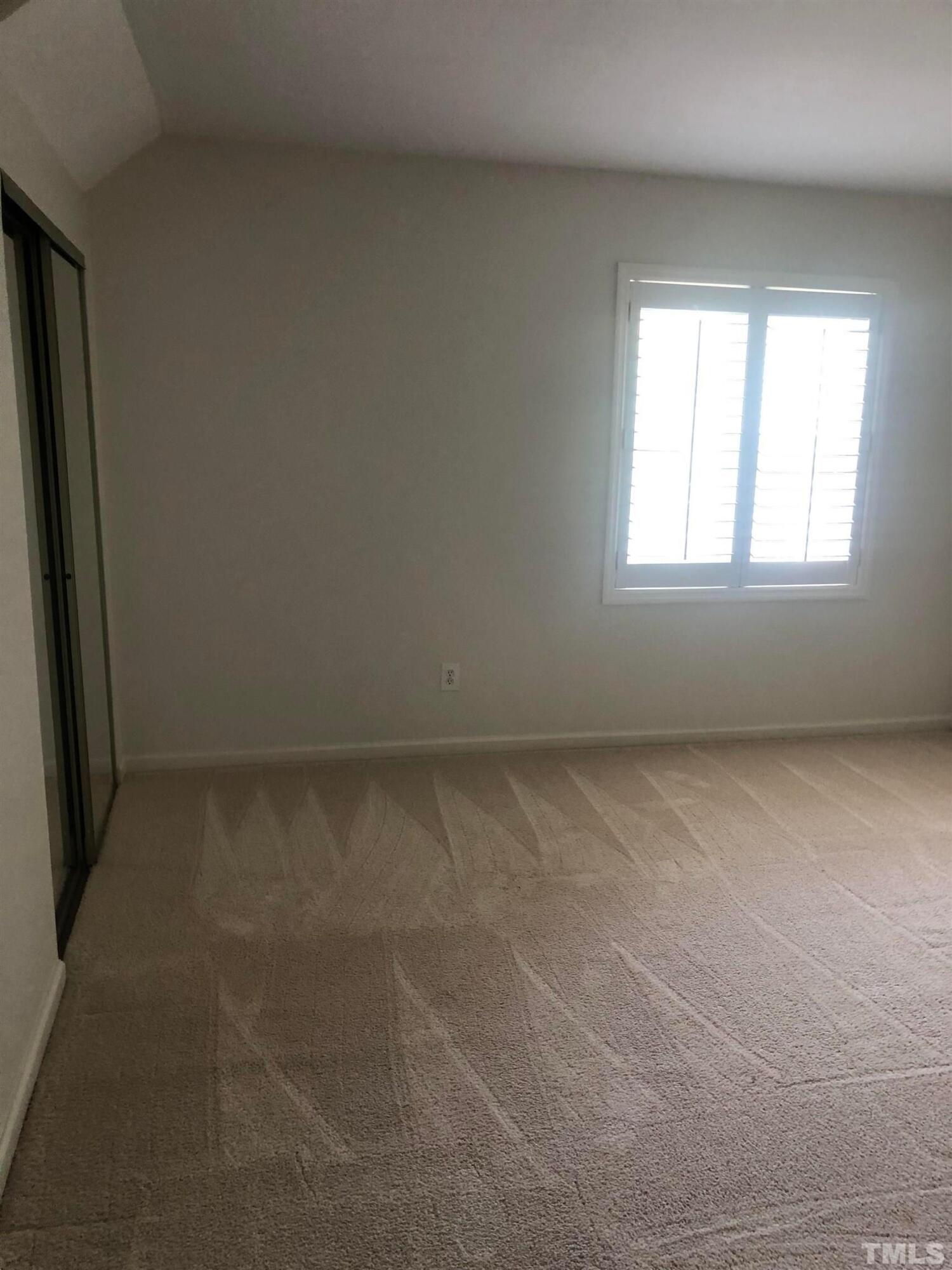 7601 Astoria Place Raleigh, NC 27612 - Photo 28 of 30 an empty room with a window