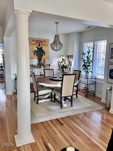 7601 Astoria Place Raleigh, NC 27612 - Photo 5 of 30 a view of a dining room with furniture window and wooden floor