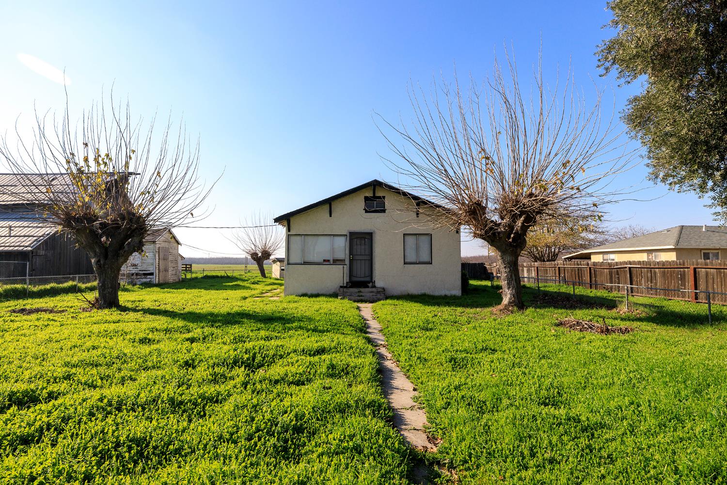5413 Crows Landing Road Modesto, CA 95358 - Photo 12 of 15 a front view of house with yard and trees
