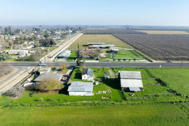 a view of a field with an ocean view