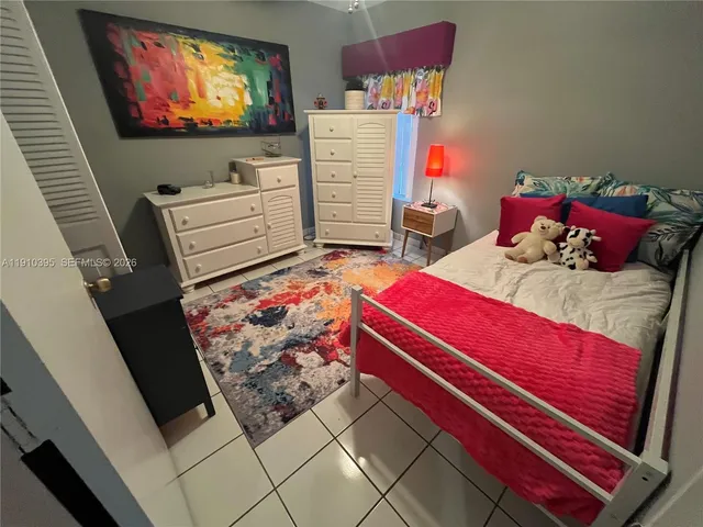 a room with furniture and a flat screen tv