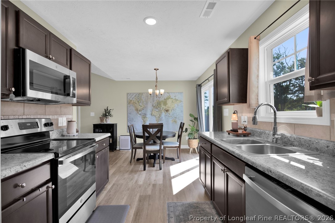351 Sandy Grove Road Parkton, NC 28371 - Photo 10 of 30 a large kitchen with granite countertop lots of counter top space