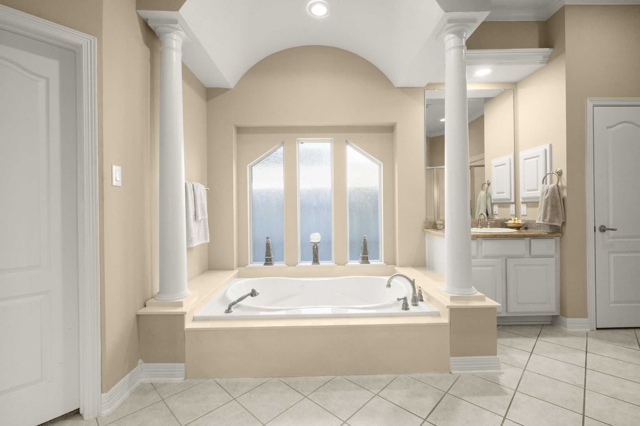 19902 Tidy Tips Lane Spring, TX 77379 - Photo 16 of 49 a bathroom with a bathtub and a shower