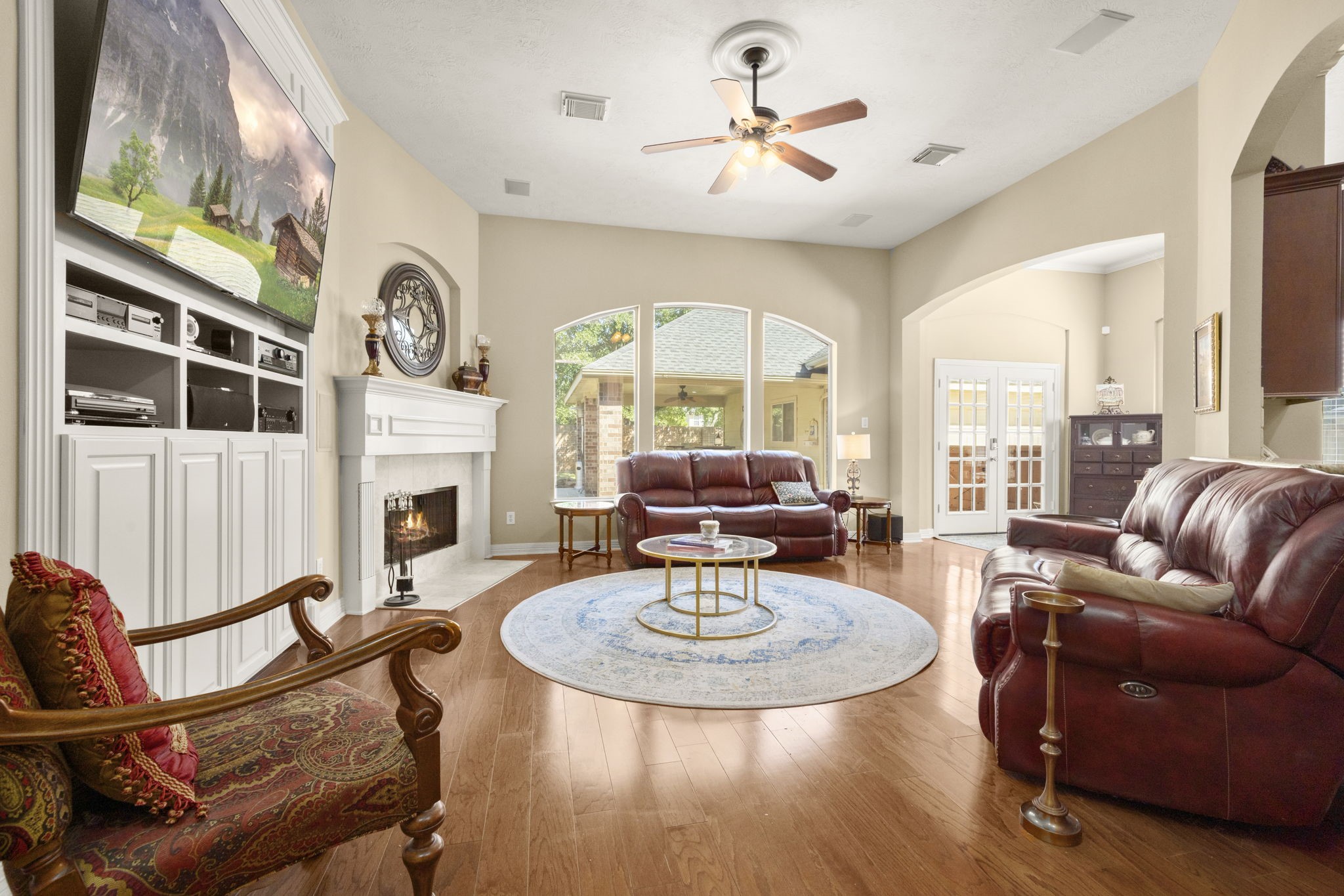 19902 Tidy Tips Lane Spring, TX 77379 - Photo 18 of 49 a living room with furniture a fireplace and a large window