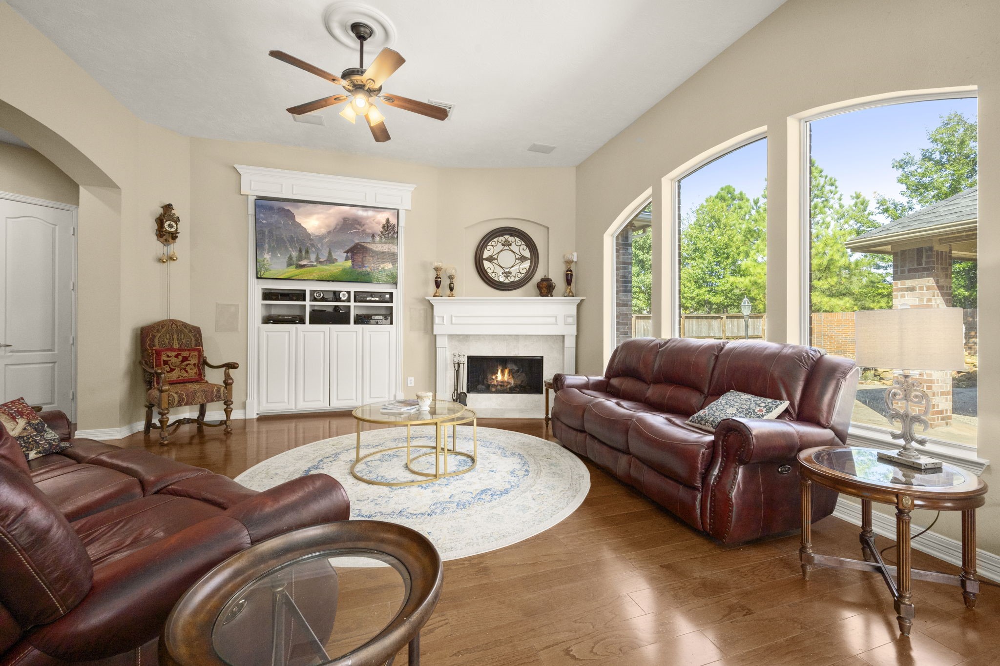 19902 Tidy Tips Lane Spring, TX 77379 - Photo 19 of 49 a living room with furniture a large window and a fireplace