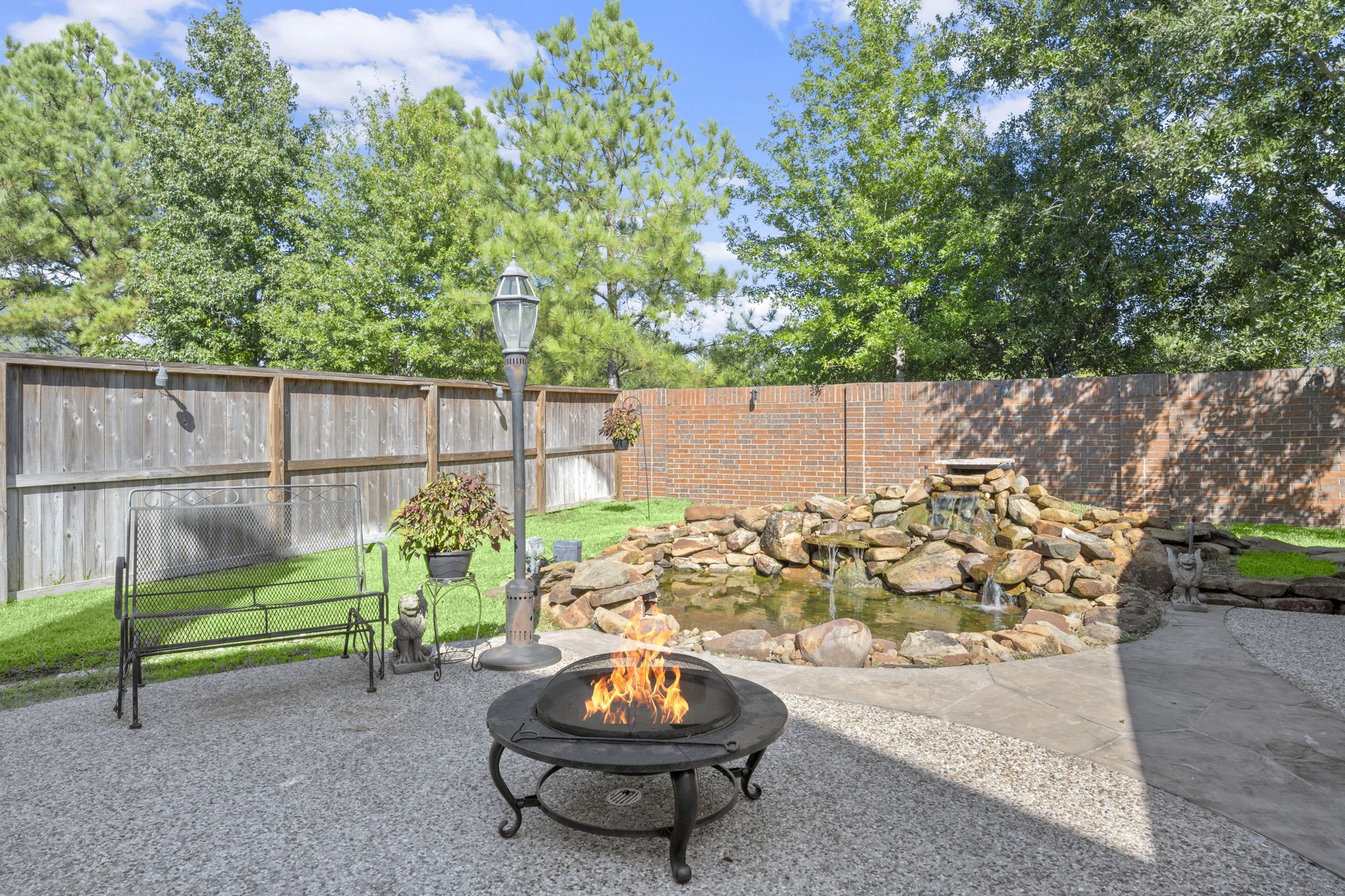 19902 Tidy Tips Lane Spring, TX 77379 - Photo 29 of 49 a view of a backyard with plants and outdoor seating