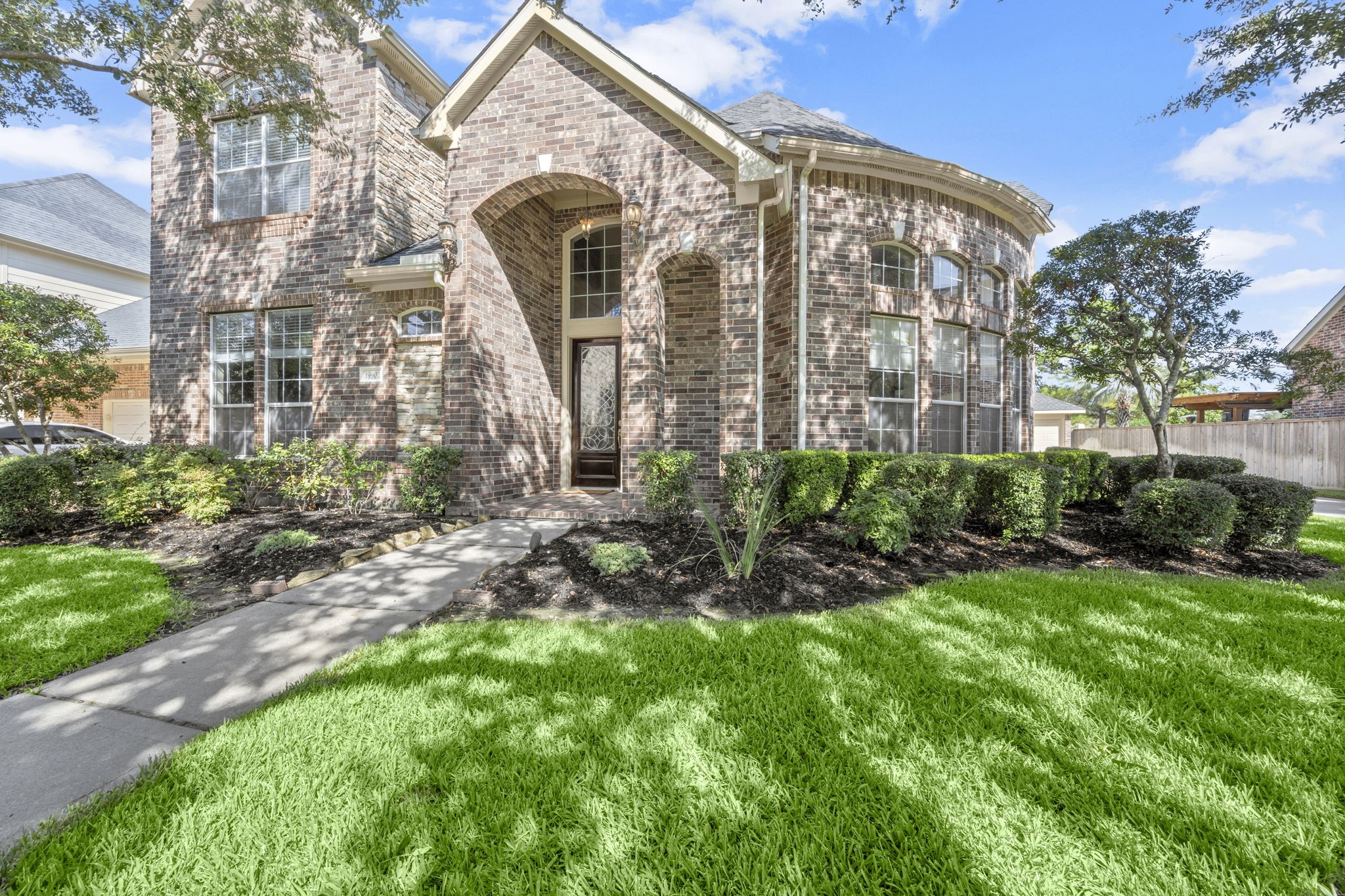 19902 Tidy Tips Lane Spring, TX 77379 - Photo 31 of 49 a front view of a house with a yard