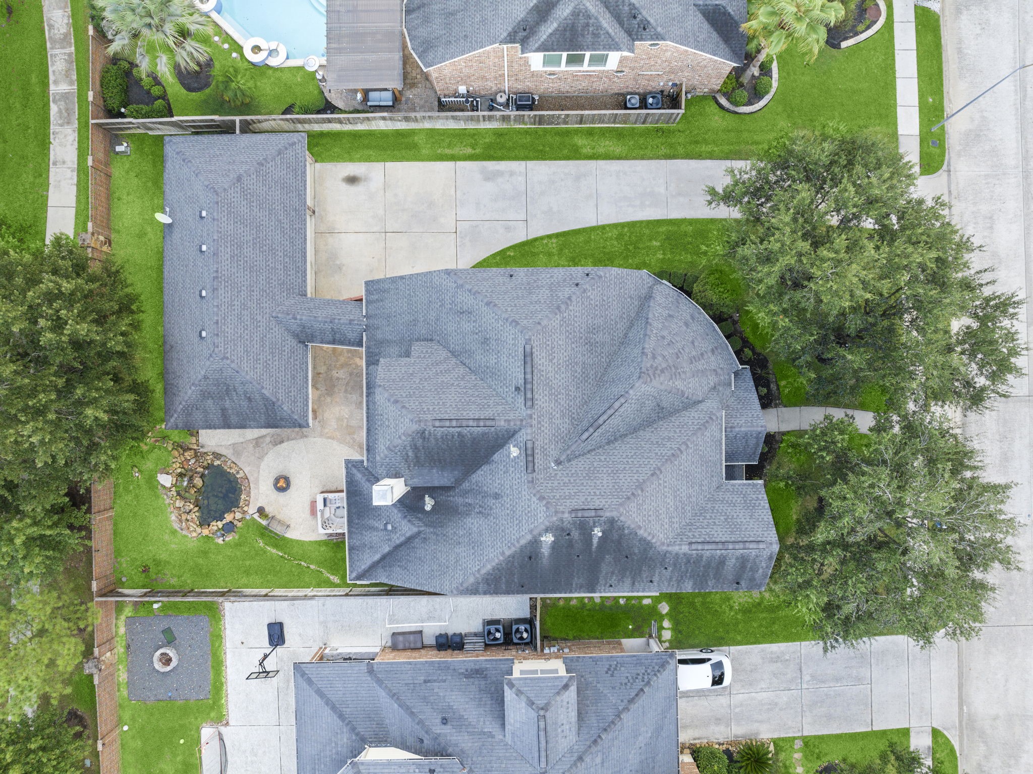 19902 Tidy Tips Lane Spring, TX 77379 - Photo 34 of 49 an aerial view of a house with a garden and a car parked