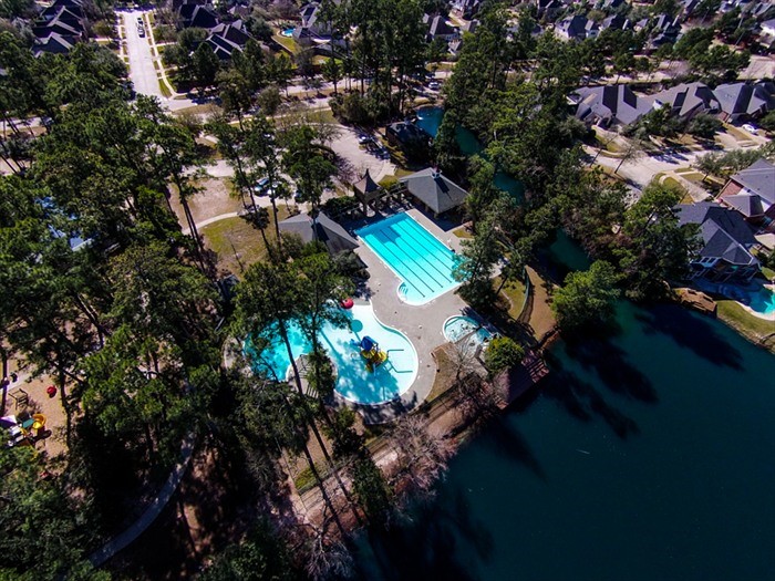 19902 Tidy Tips Lane Spring, TX 77379 - Photo 46 of 49 an aerial view of residential houses with outdoor space and trees