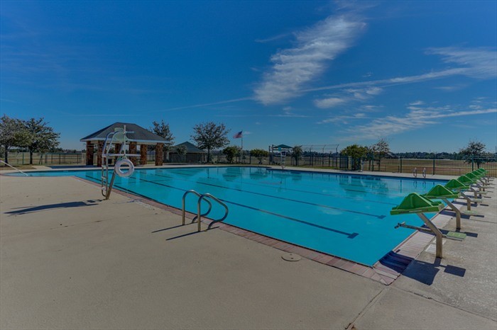 19902 Tidy Tips Lane Spring, TX 77379 - Photo 48 of 49 a view of a lake with outdoor space and sitting area
