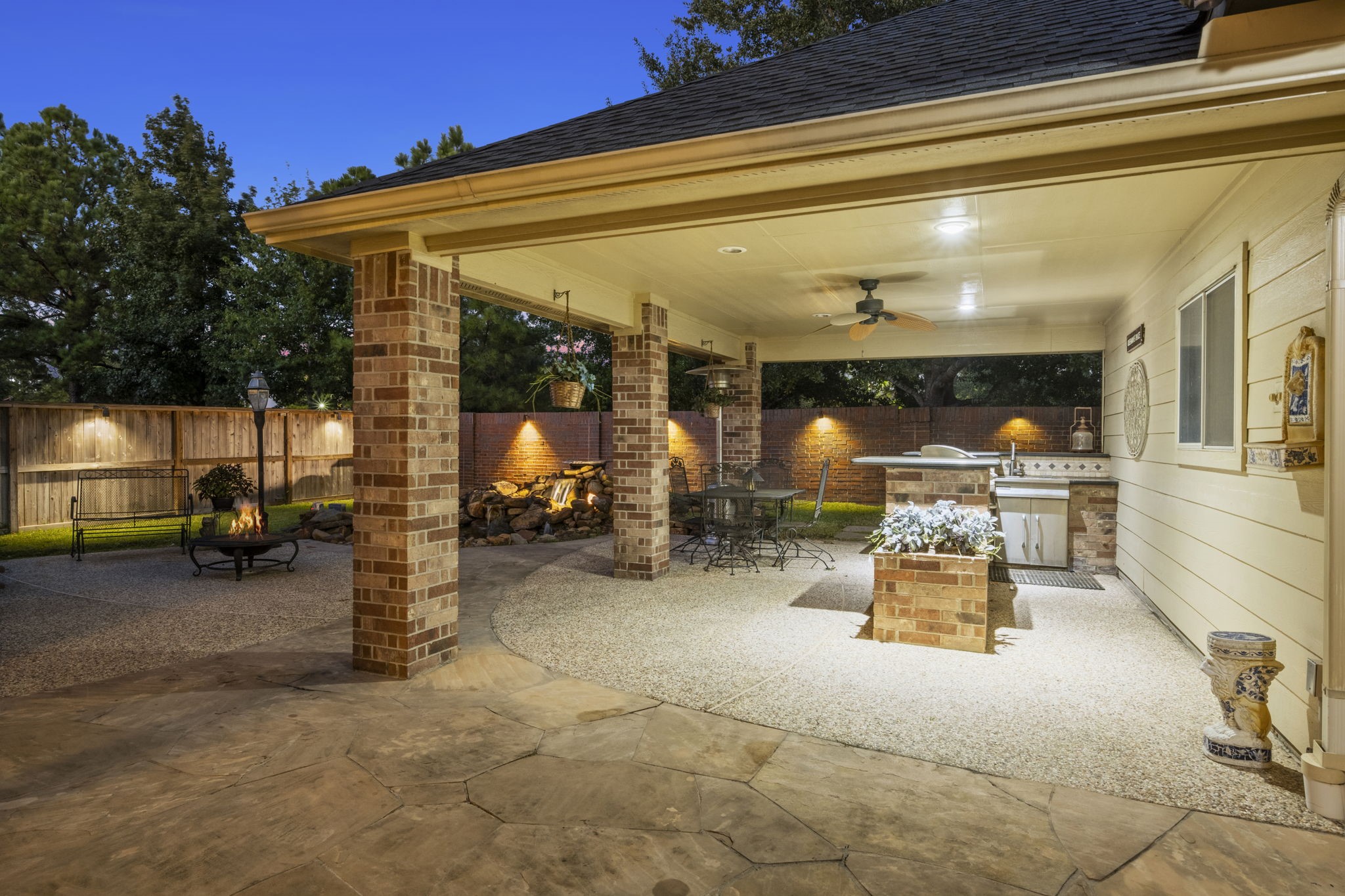 19902 Tidy Tips Lane Spring, TX 77379 - Photo 5 of 49 a view of a patio with table and chairs under an umbrella