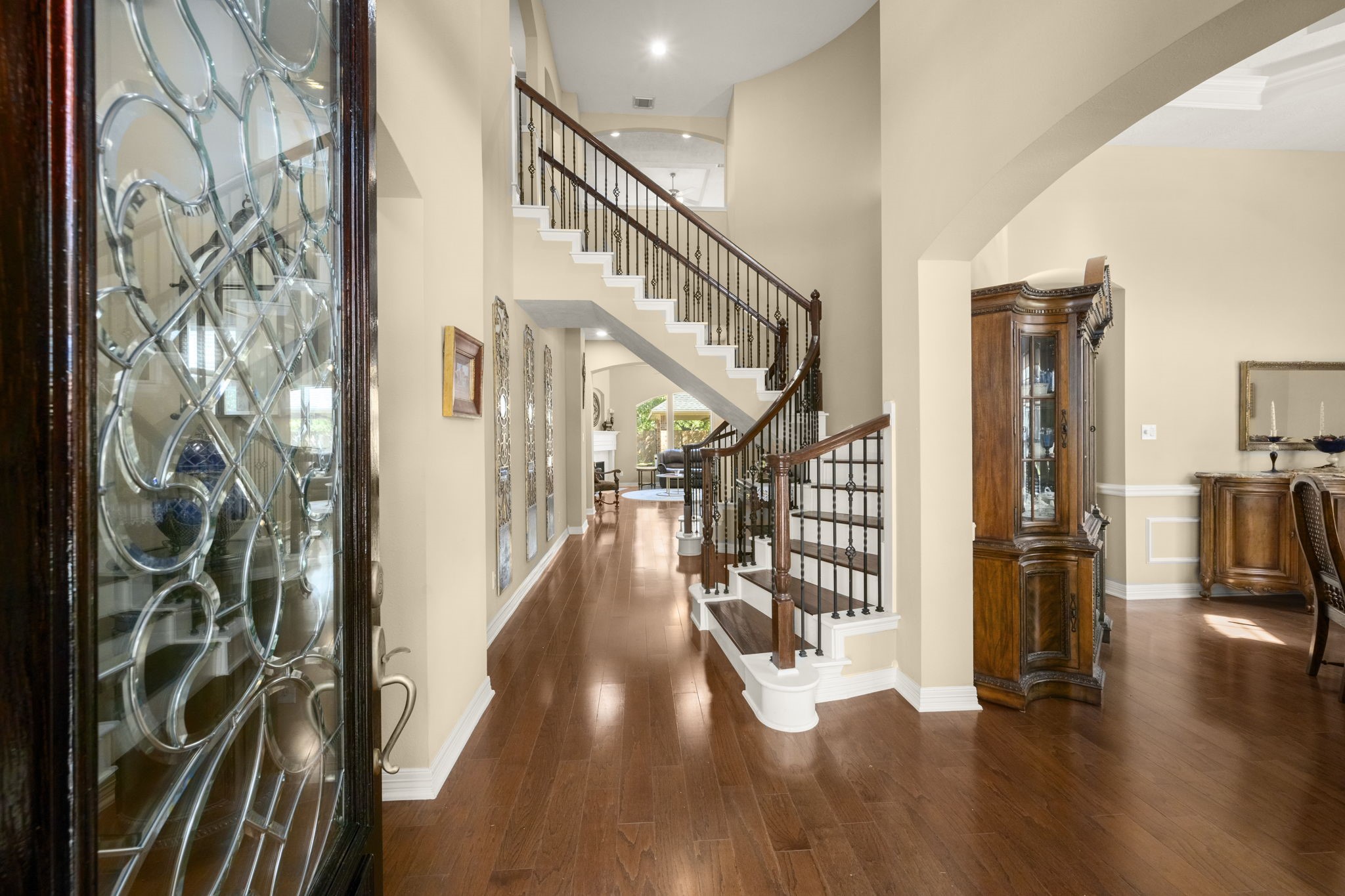 19902 Tidy Tips Lane Spring, TX 77379 - Photo 7 of 49 a hallway and a livingroom with furniture stairs