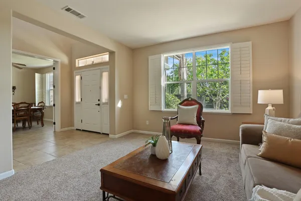 a kitchen with stainless steel appliances granite countertop a stove a refrigerator and a sink