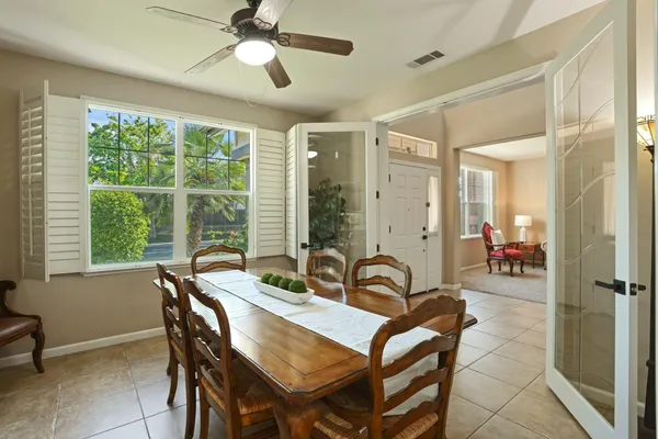 a living room with furniture kitchen and a window
