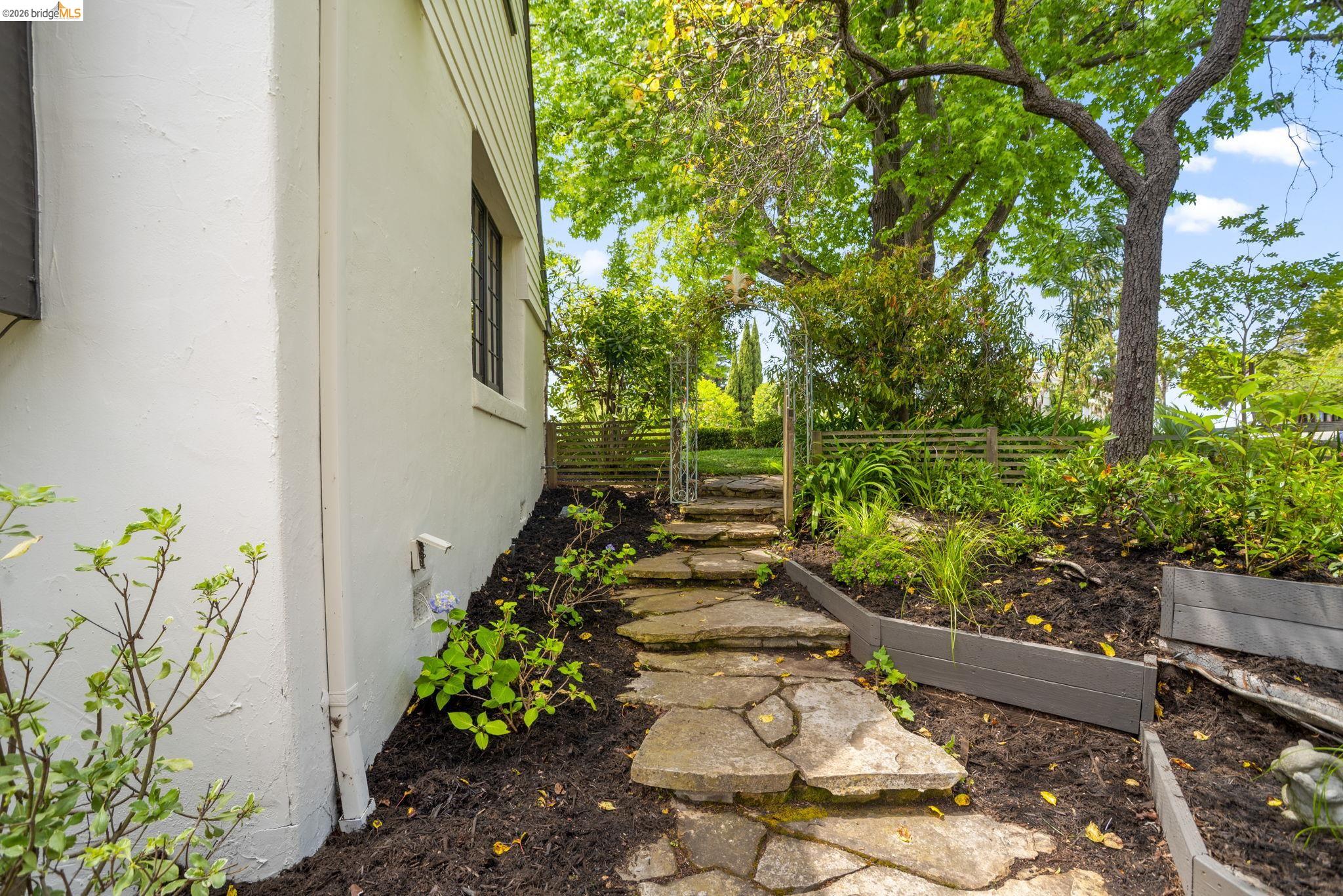 1087 Hubert Road Oakland, CA 94610 - Photo 54 of 67 Stone pathway ascending through mulched garden beds