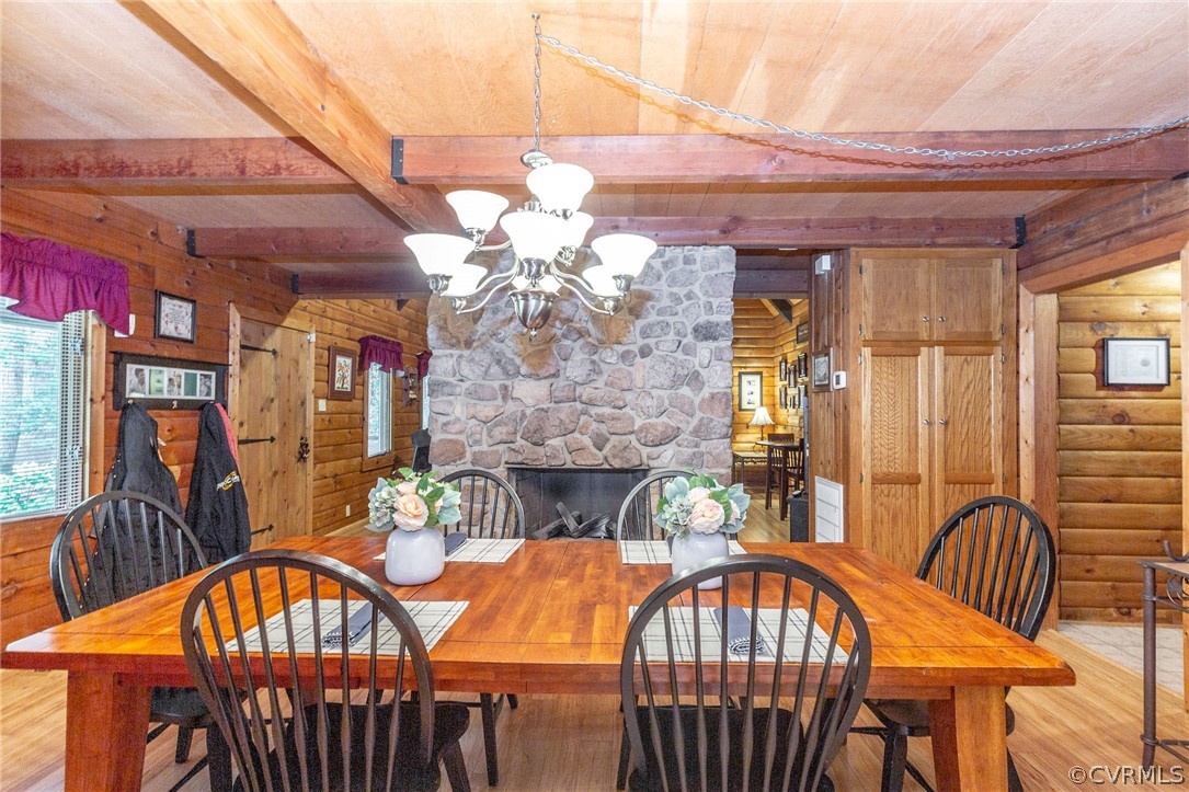 9901 Millers Run Road Chesterfield, VA 23236 - Photo 11 of 44 a view of a dining room with furniture and chandelier