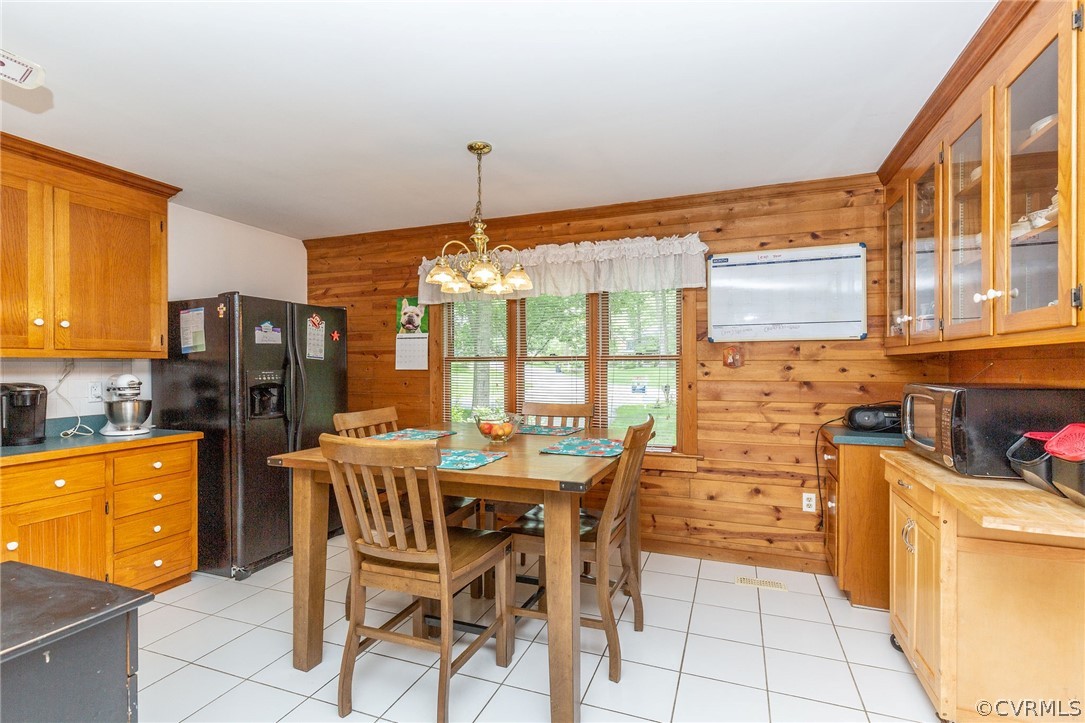 9901 Millers Run Road Chesterfield, VA 23236 - Photo 14 of 44 a dining hall with stainless steel appliances a dining table chairs and chandelier