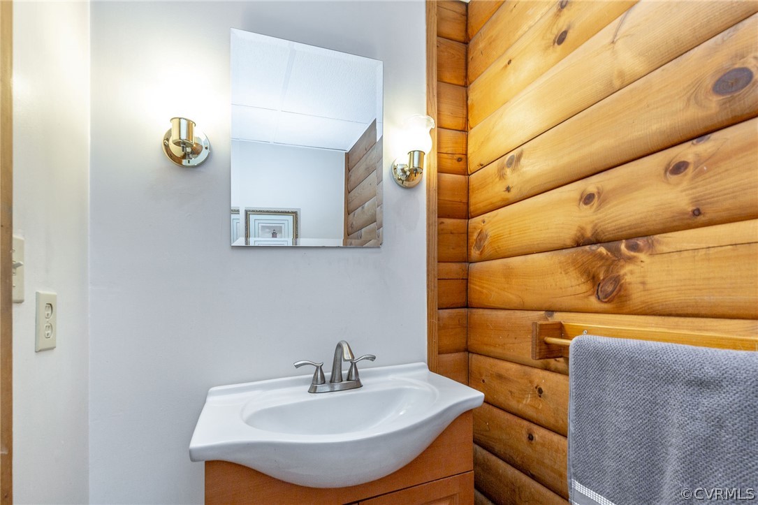 9901 Millers Run Road Chesterfield, VA 23236 - Photo 21 of 44 a bathroom with a sink and a mirror