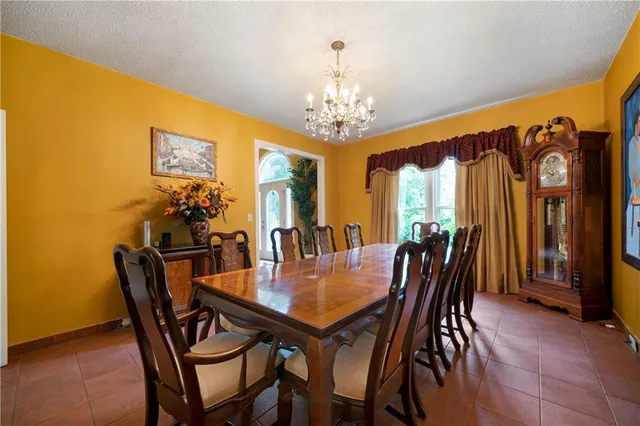 a view of a dining room with furniture and window