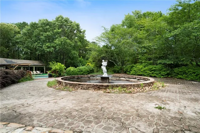 a view of a garden with a fountain